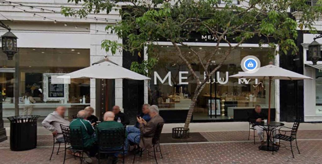 Commercial retail boutique exterior facade renovation by MOMA Construction Group in Glendale showing an open-air pedestrian shopping plaza with patrons seated at outdoor cafe tables.